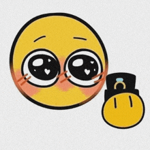a yellow smiley face with big eyes and hearts on it is holding a smaller yellow smiley face .