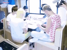 a group of people sitting around a table with the word cherry on the bottom left