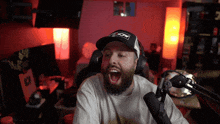 a man with a beard wearing a hat that says anchor