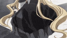 a girl with blonde hair is wearing a black and grey dress