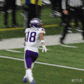 a football player named jefferson is running on the field