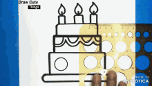 a ruler is being used to draw a cake on a piece of paper that says draw cute things