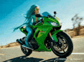 a woman with green hair riding a green motorcycle