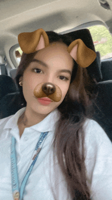 a girl in a car with a snapchat filter on her face