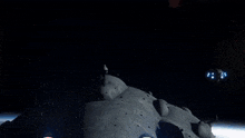 a space ship is flying over a large rock formation in space