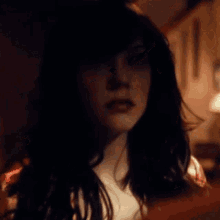 a woman with a serious look on her face