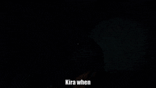 a person in a dark room with the words kira when written below them