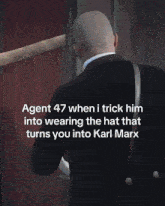 a bald man in a suit and tie with a caption that says agent 47