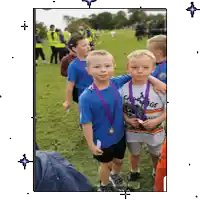 a boy wearing a shirt that says carnage is standing next to a boy wearing a blue shirt
