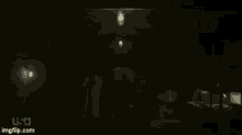 a man in a white shirt is standing in a dark hallway with usa written on the bottom