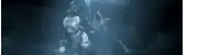 a blurry picture of a person in a dark room with a light shining on them .