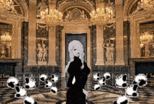 a woman in a black dress is standing in a large room with a lot of chairs
