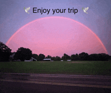 a picture of a rainbow with the words enjoy your trip