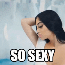 a woman in a bathtub with the words so sexy written on the bottom