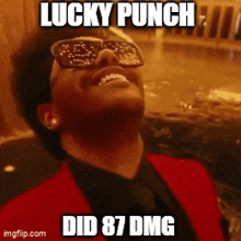 a man wearing sunglasses and a red suit says lucky punch