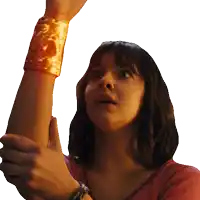 a woman wearing a gold bracelet on her wrist looks up