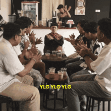 a group of people clapping in front of a sign that says moon dust coffee