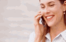 a woman is talking on a cell phone with her mouth wide open