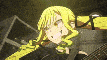 a girl with blonde hair is holding a guitar and smiling
