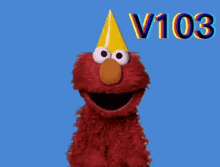 elmo from sesame street is wearing a party hat and says let 's get it