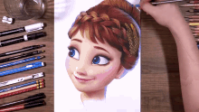 a drawing of anna from frozen is on a table with pencils and pens