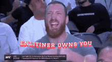 a man crying in a crowd with the words enlightener owns you written above him