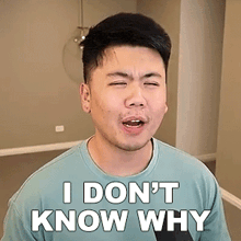 a man in a blue shirt is making a funny face and saying `` i don 't know why '' .