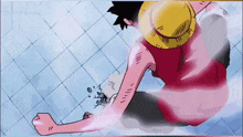 a cartoon character with a straw hat is holding his fist up