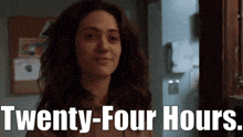 a woman says twenty-four hours in front of a door