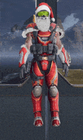 a man in a santa hat is standing in front of a mountain