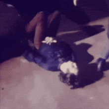 a person is laying on the ground with their legs crossed