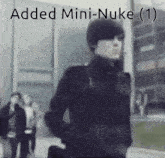 a blurry picture of a man with the words added mini-nuke ( 1 ) below him
