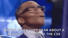 a man wearing glasses and a suit is looking up at the sky .