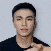 a man with his eyes closed is being touched by a hand
