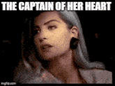 a close up of a woman 's face with the words `` the captain of her heart '' above her .