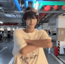 a person in a parking garage with a sign that says bi