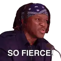 a man wearing a bandana is speaking into a microphone and says " so fierce "
