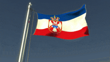 a red white and blue flag with the coat of arms on it
