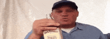 a man is holding a bottle of jack daniels tennessee whiskey