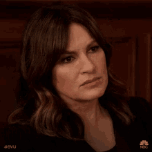 a close up of a woman 's face with the hashtag #svu on it