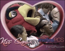 Mascot Leans In For A Kiss, Eats Lady’s Face GIF - Kiss Cam Mascot Kiss GIFs
