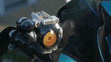 a blurred image of a person holding a light that says ' a ' on it