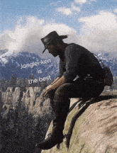 a man in a cowboy hat sits on the edge of a cliff with the words jonglei-ken is the best written below him