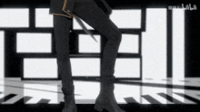 a close up of a person 's legs in front of a black and white background
