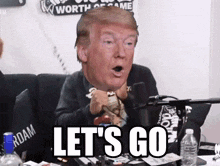 donald trump says let 's go while sitting in front of a laptop