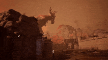 a statue of a deer with antlers stands on top of a rock