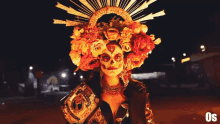 a woman in a day of the dead costume with flowers on her head
