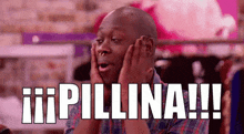 a man in a plaid shirt is holding his face with his hands and says pillina !!! .