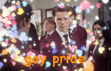 a man in a suit and tie is surrounded by hearts and the words gay pride in orange letters