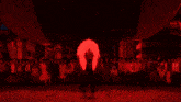a close up of a red object with a light shining through it